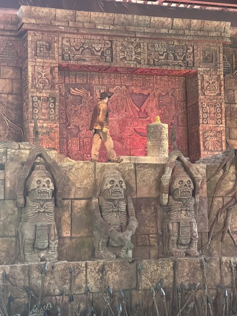 Performer as Indiana Jones at the temple idol set