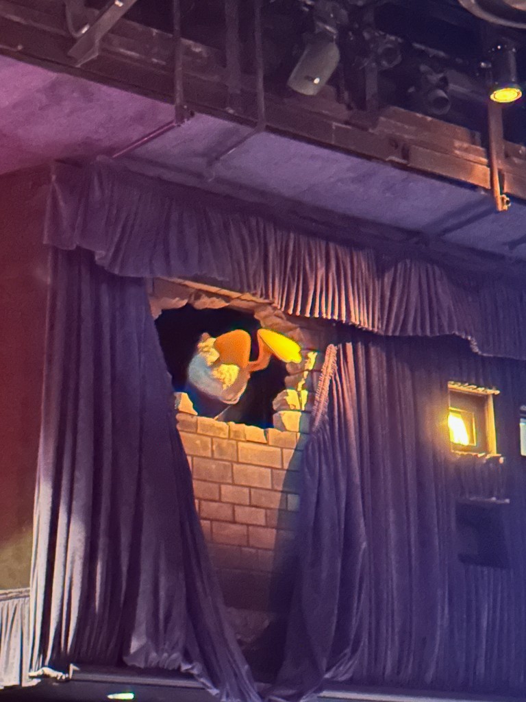 Donald Duck bursting through a brick wall in PhilharMagic