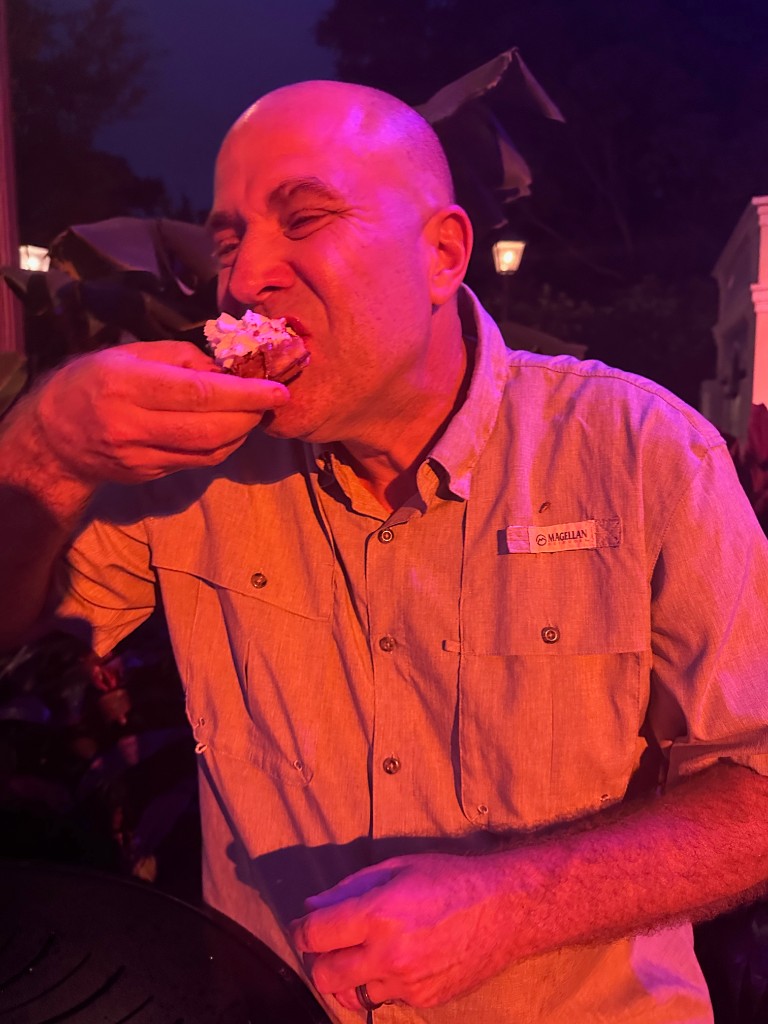 Ryan eating the Belgium waffle at EPCOT