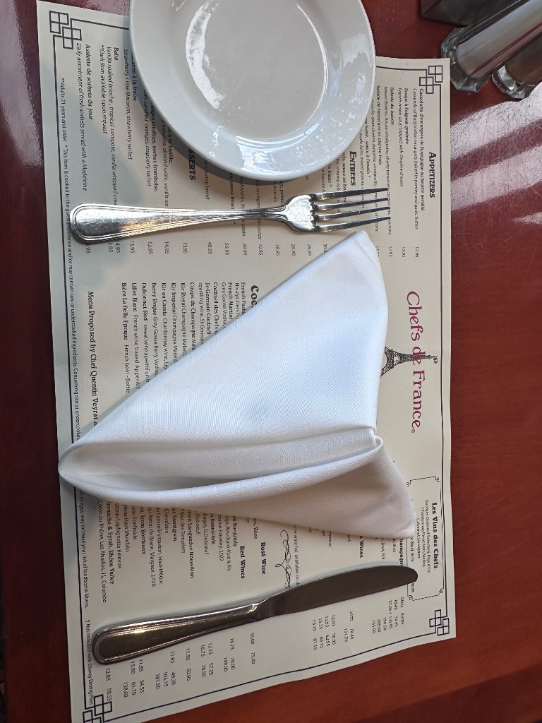 Chefs de France placemat menu with napkin place setting