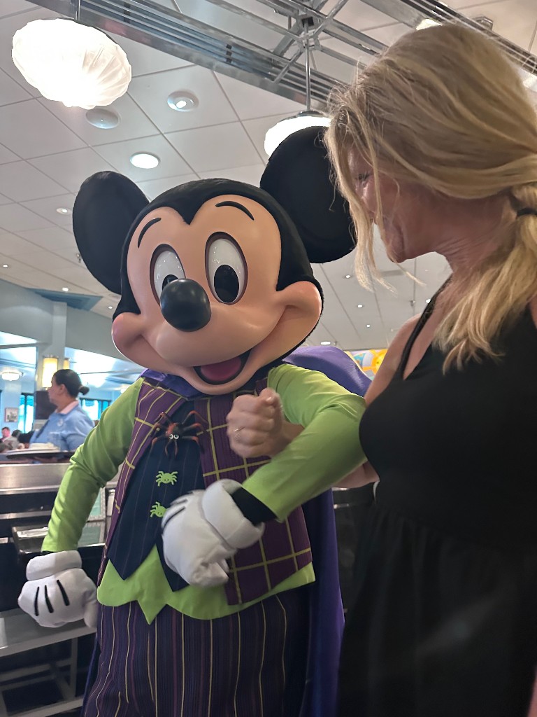 Sarah with Mickey Mouse in Halloween costume