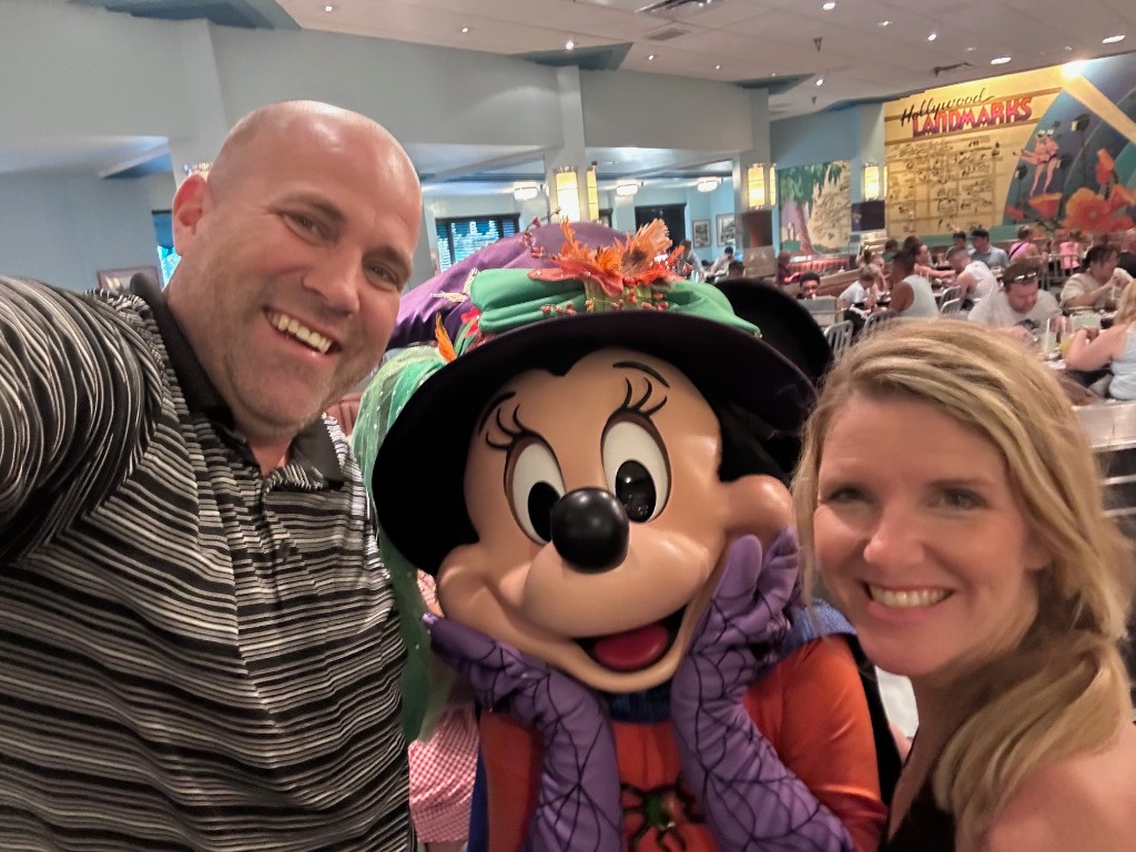 Ryan and Sarah with Minnie Mouse in her Halloween witch costume