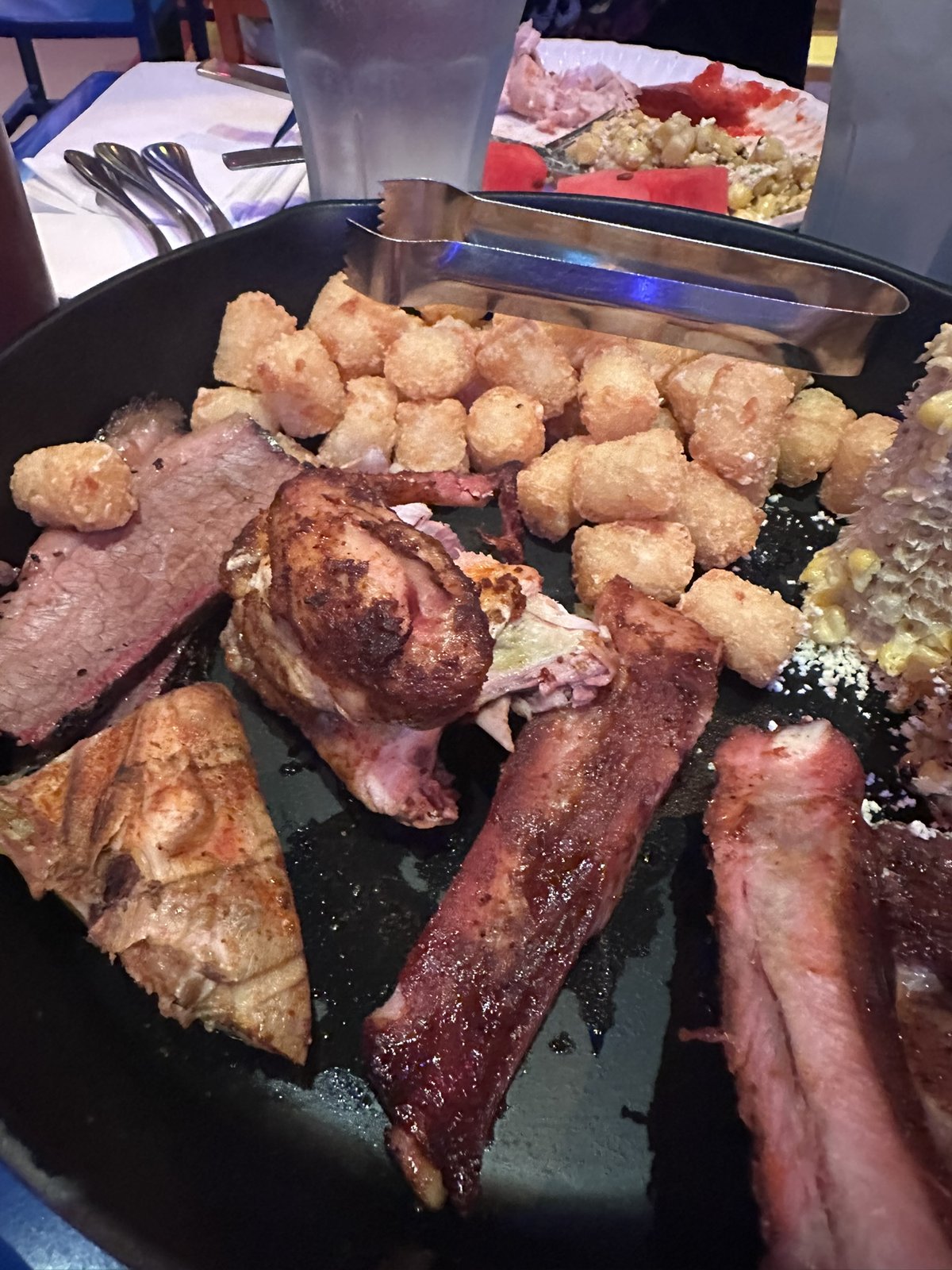 Close-up of the smoked meats and potato barrels