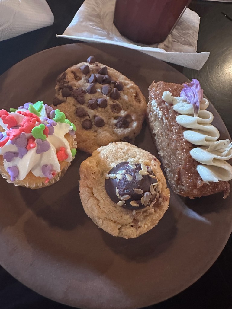 Dessert plate with Mickey cupcake, cookie, and cake