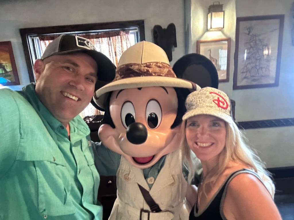 Ryan and Sarah with Mickey Mouse in safari gear at Tusker House
