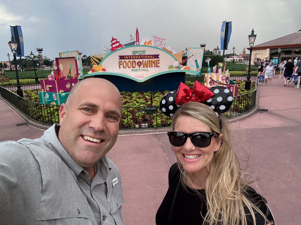 Ryan and Sarah at the EPCOT International Food and Wine Festival sign