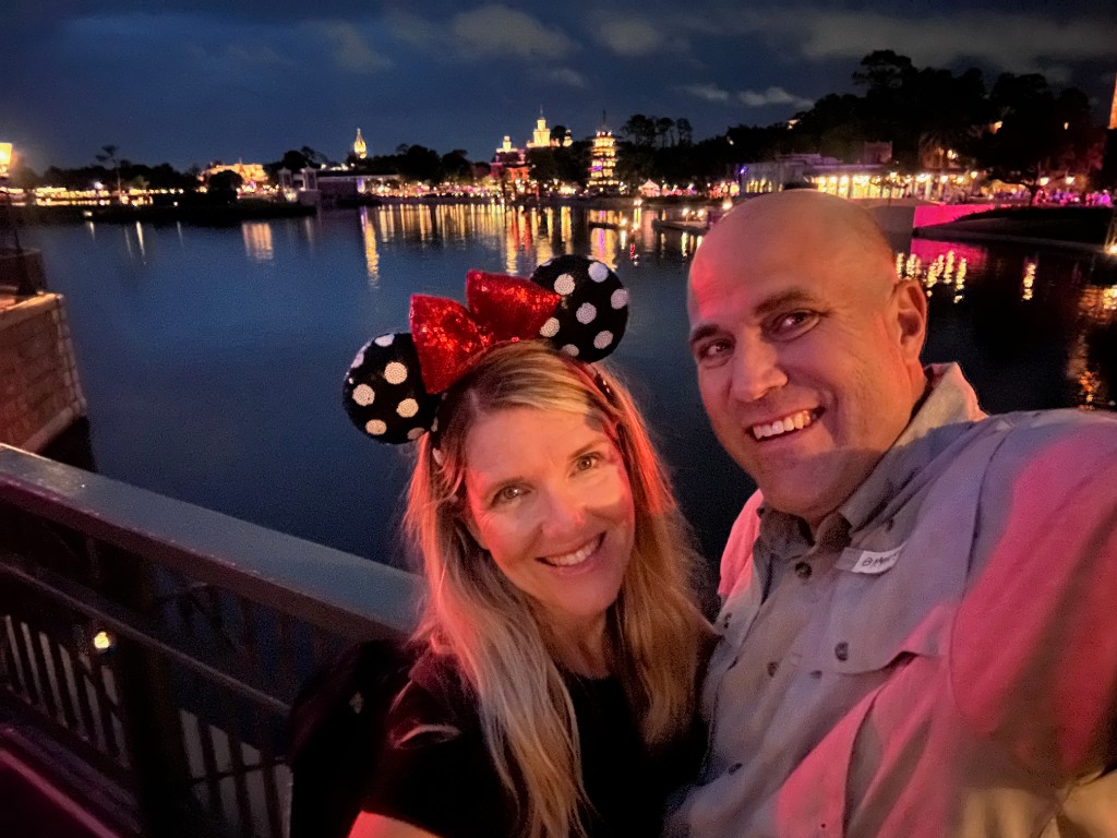 Ryan and Sarah on World Showcase lagoon at night