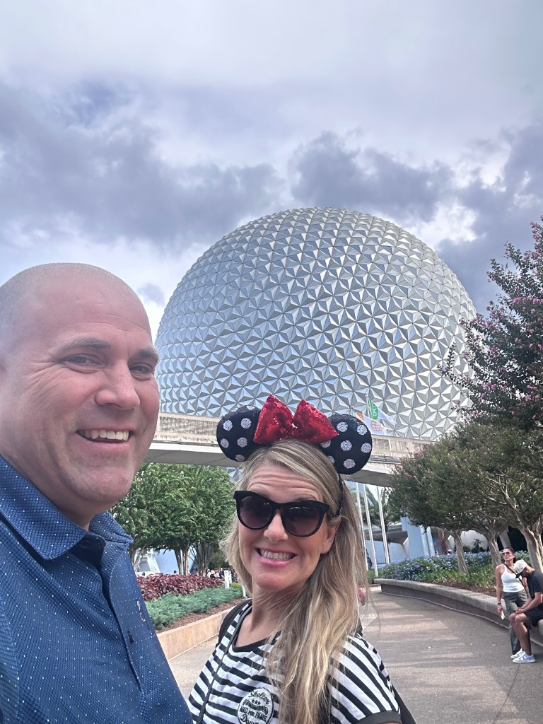 Ryan and Sarah in front of Spaceship Earth at EPCOT