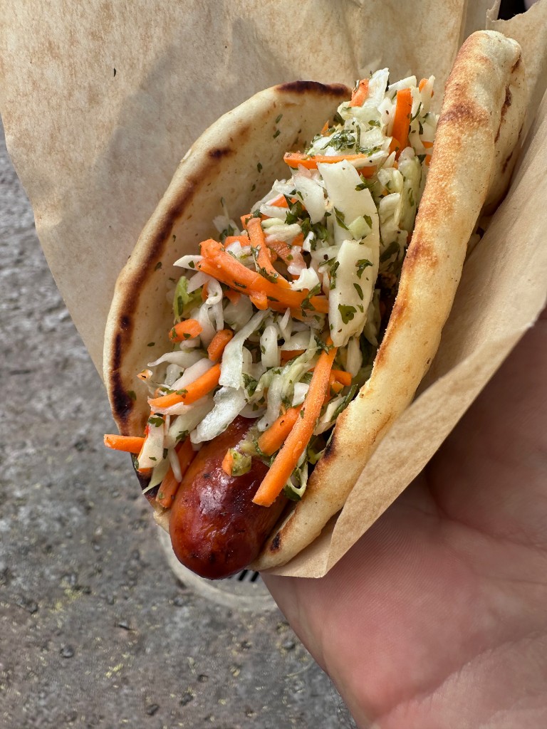 Lunch Ronto Wrap — pita, sausage, and slaw