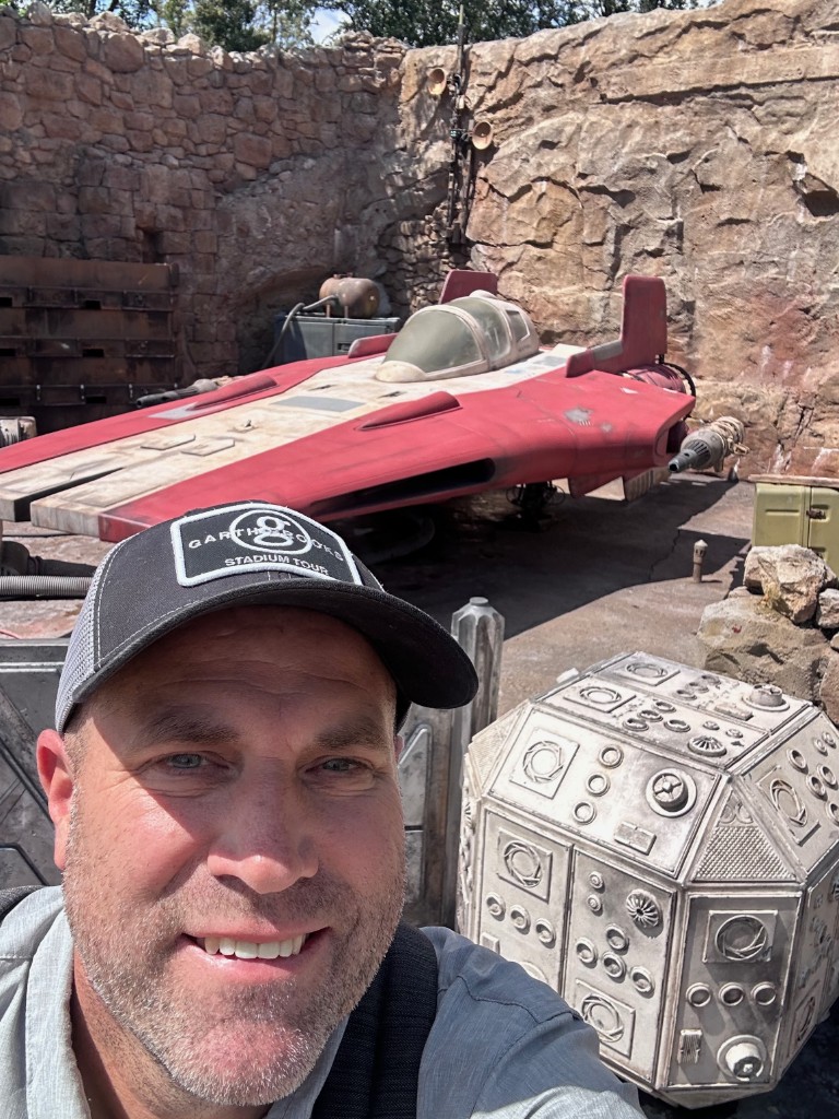 Ryan selfie with a red landspeeder in Galaxy’s Edge