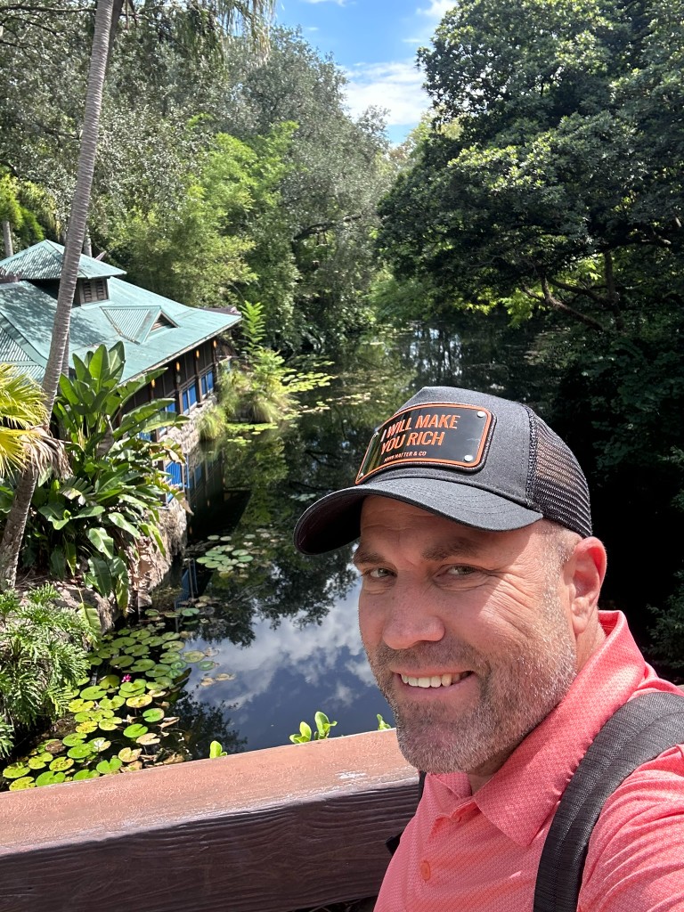 Ryan at Animal Kingdom with Expedition Everest across the Discovery River