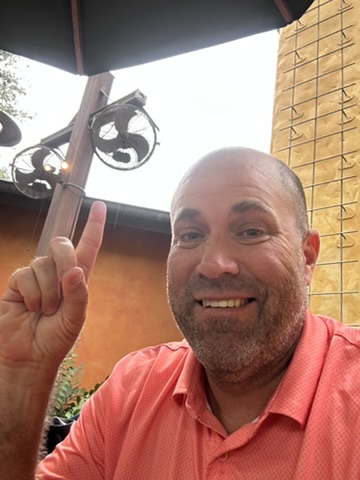 Ryan under the outdoor fans on the Pizzafari patio