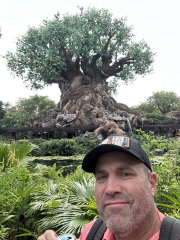 Ryan with the Tree of Life behind him