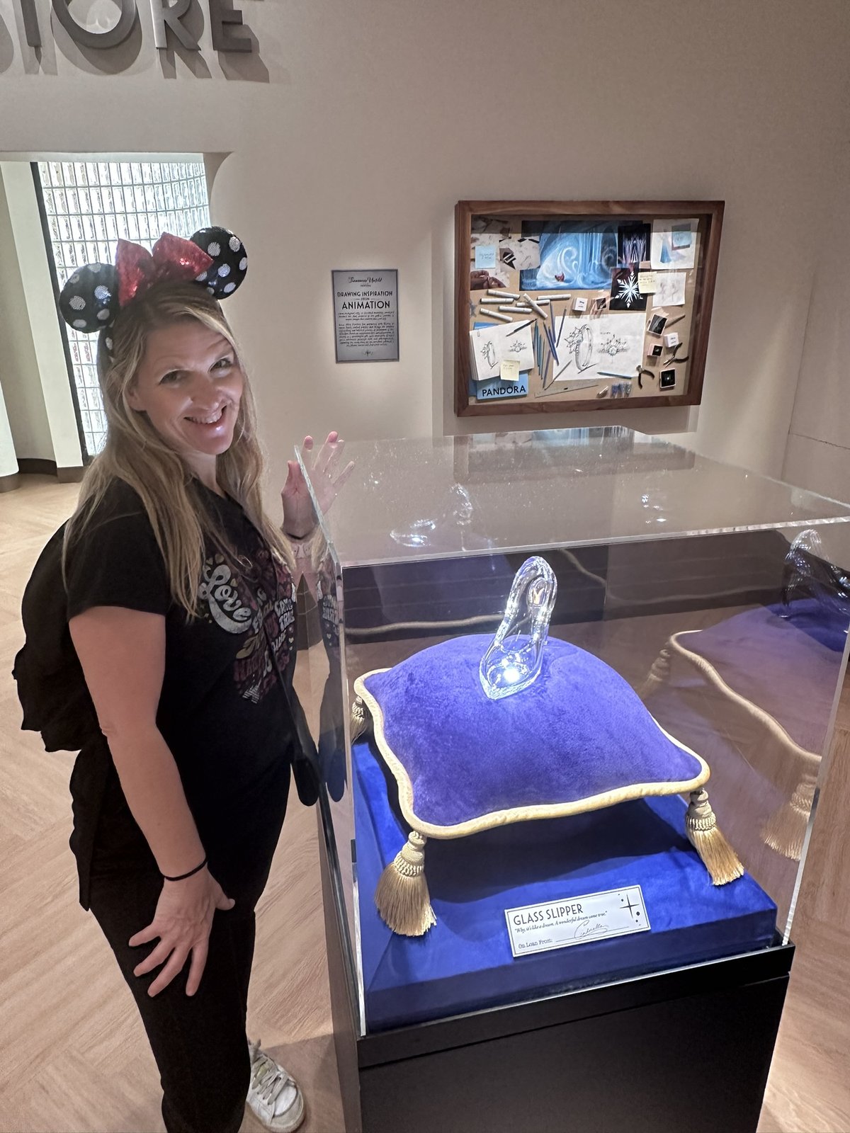 Sarah next to the glass slipper display
