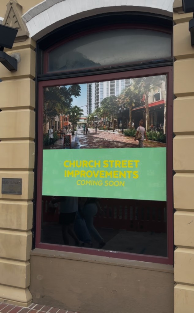 Church Street Improvements Coming Soon poster in a downtown Orlando window