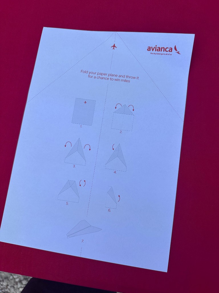 Paper airplane folding instructions at the Avianca activation