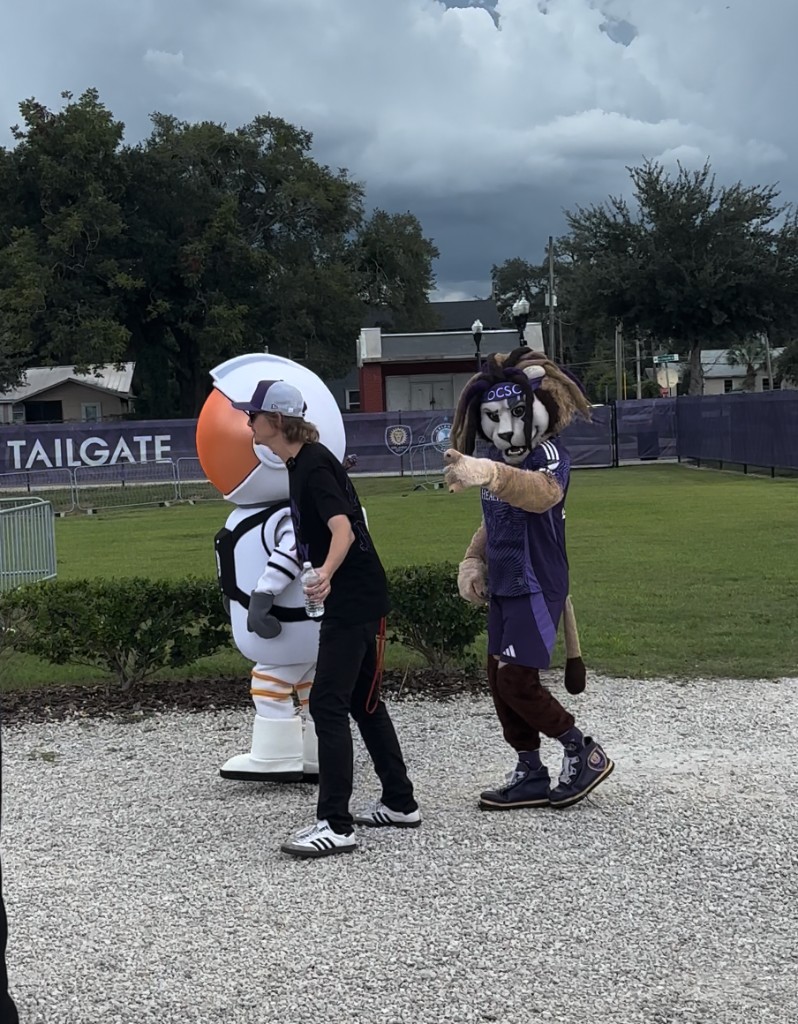 Kingston the Lion and MCO astronaut at fan fest