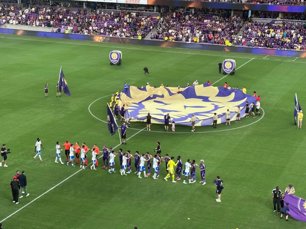 Orlando City and San Diego players shake hands at midfield