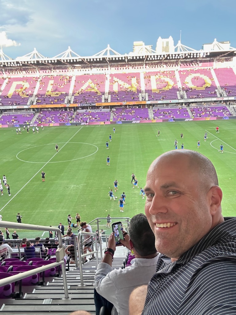 Ryan selfie above the pitch with ORLANDO seat lettering