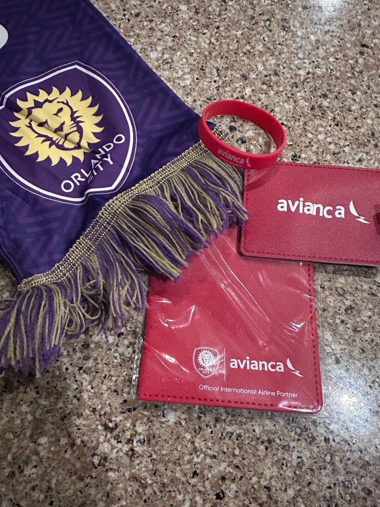 Avianca passport holder, luggage tag, wristband, and Orlando City scarf