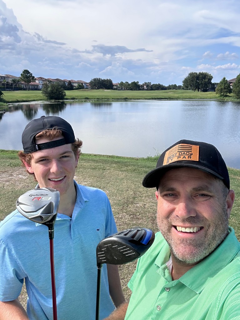 Ryan and Bryce with drivers at Eagle Creek Golf Club in Lake Nona
