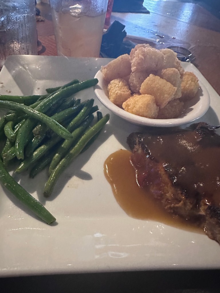 Meatloaf with gravy, green beans, and tater tots