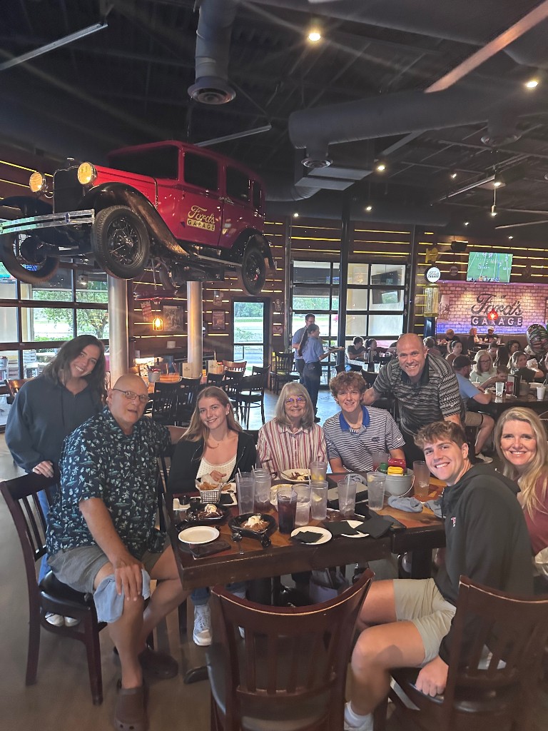 Birthday table under the hanging Ford car inside Ford's Garage