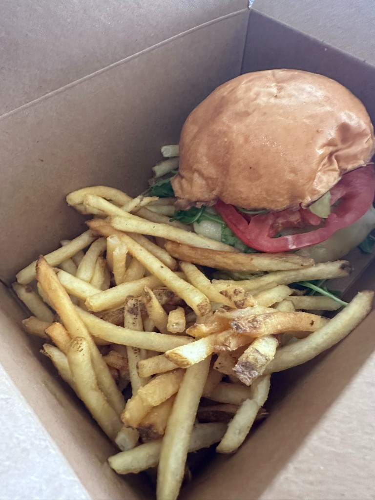 Spicy chicken sandwich and fries from Contempo Café to-go