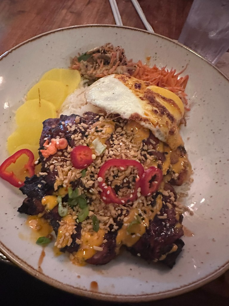 Korean Beef with fried egg, pickled radish, and rice