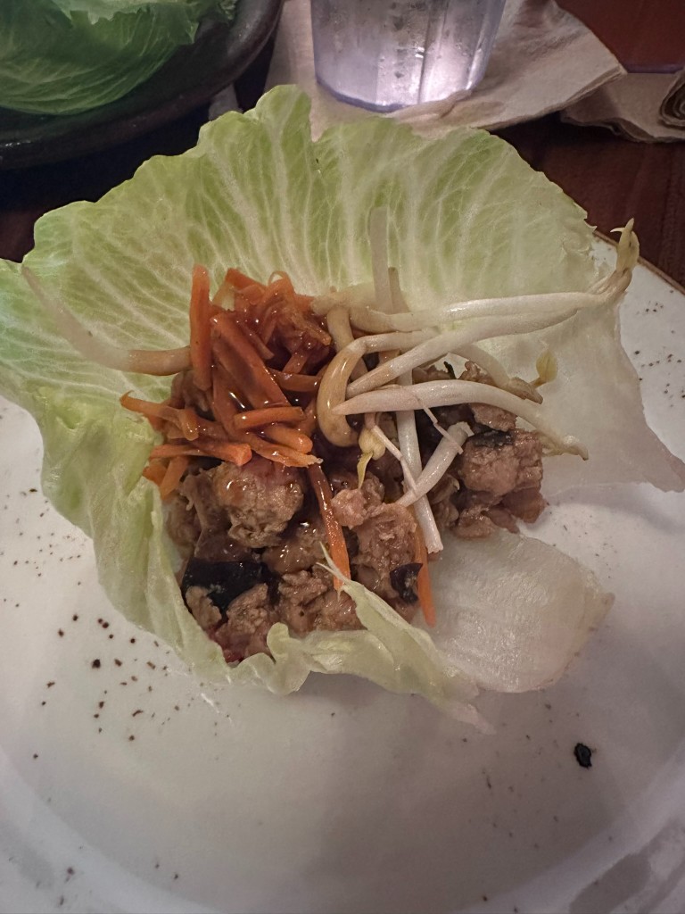 Assembled lettuce wrap with sweet soy glaze