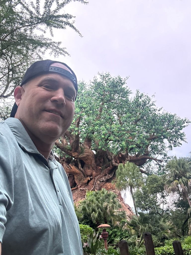 Ryan in front of the Tree of Life on a hot overcast day