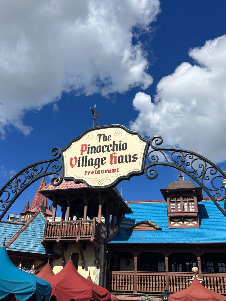 Pinocchio Village Haus restaurant sign in Fantasyland