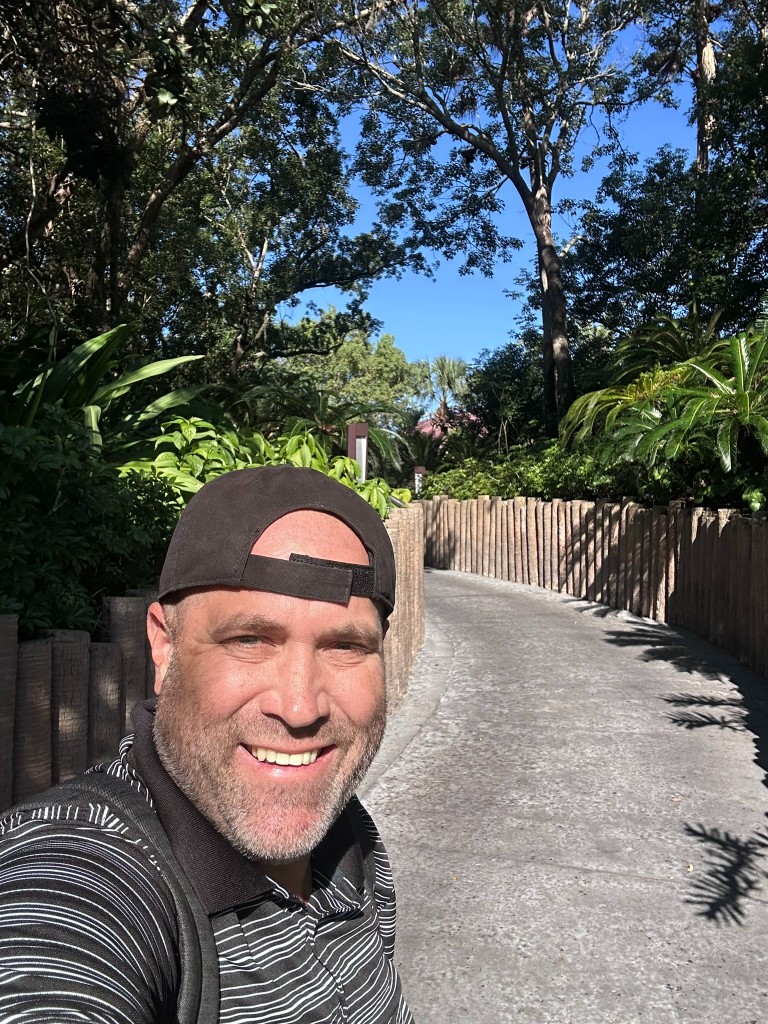 Ryan on a resort walking path between Magic Kingdom area hotels
