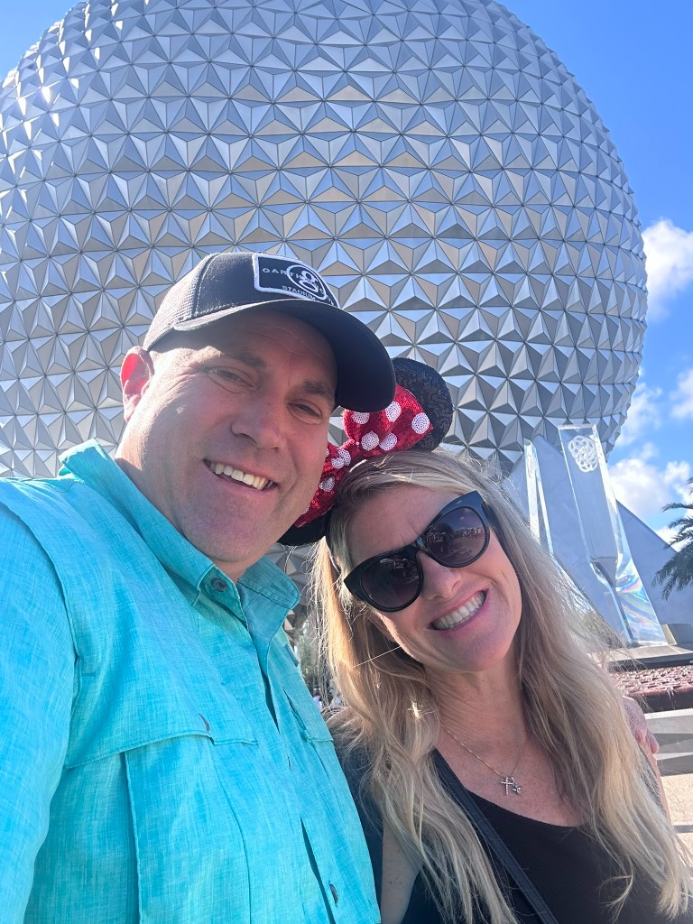 Ryan and Sarah selfie with Spaceship Earth behind them