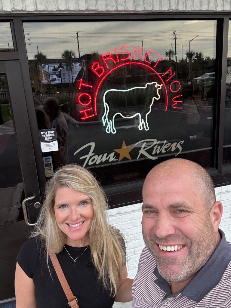Ryan and Sarah outside 4 Rivers Smokehouse on University Boulevard