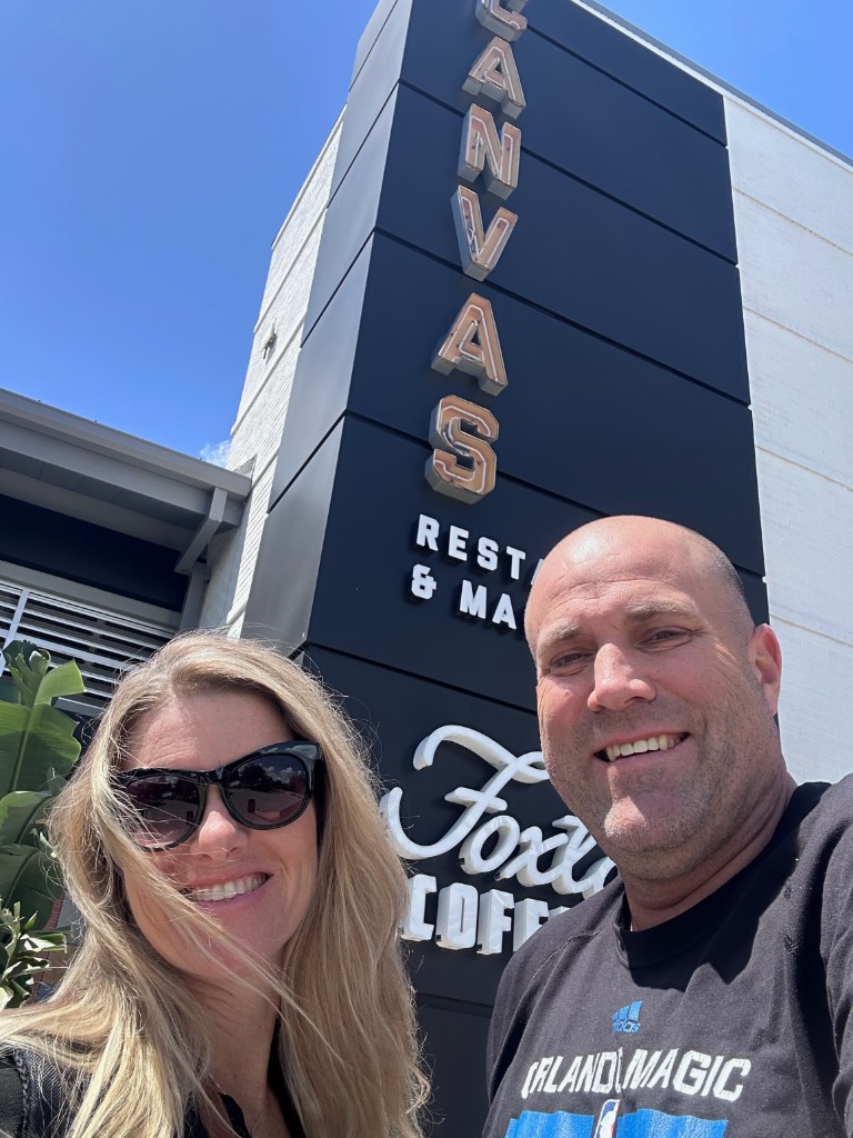 Ryan and Sarah outside Canvas Restaurant and Market in Lake Nona