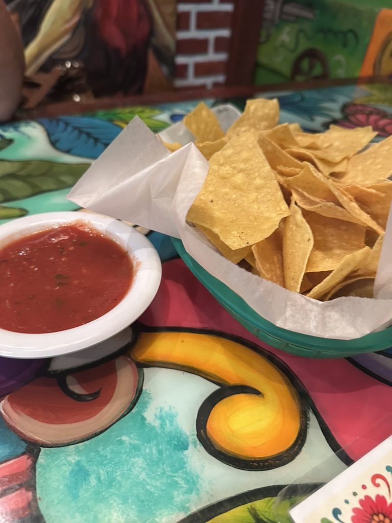 Chips and salsa on a painted table