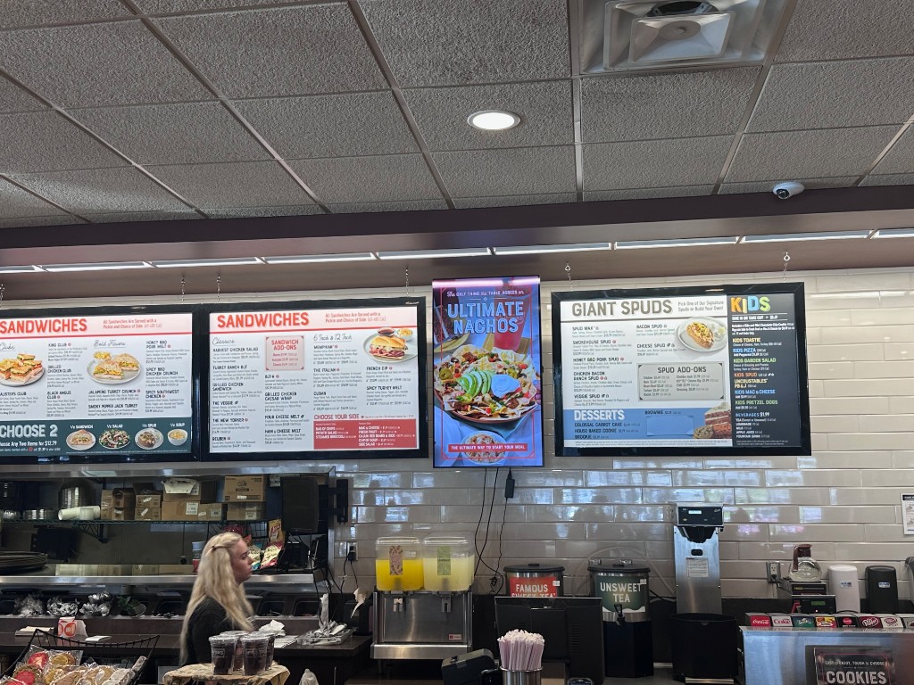 Menu boards and Famous Sweet Tea dispensers at McAlister's Deli