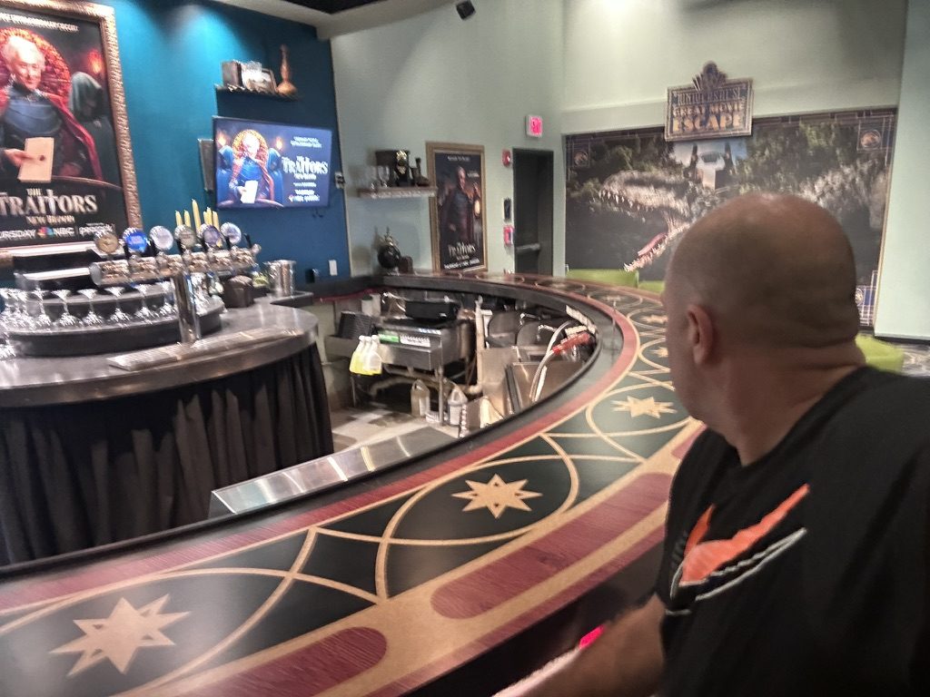 Ryan sitting at the star-patterned Roundtable bar