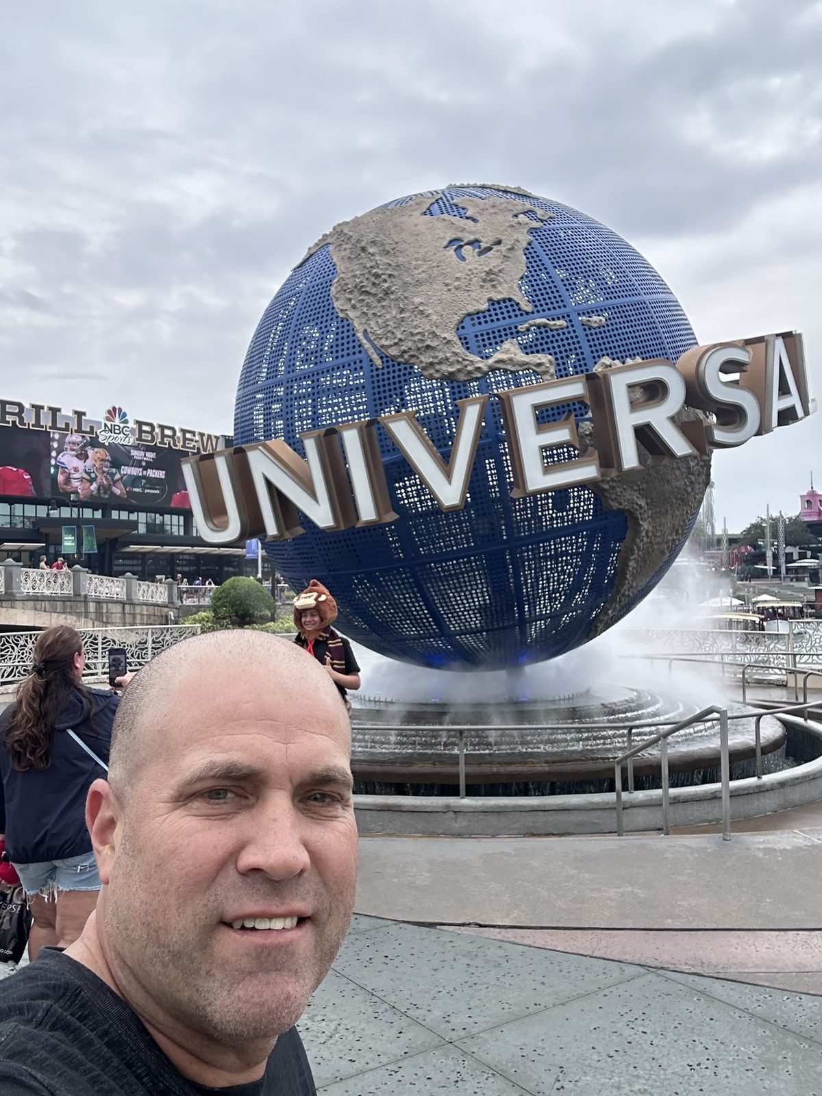 Ryan taking a selfie at the Universal globe fountain